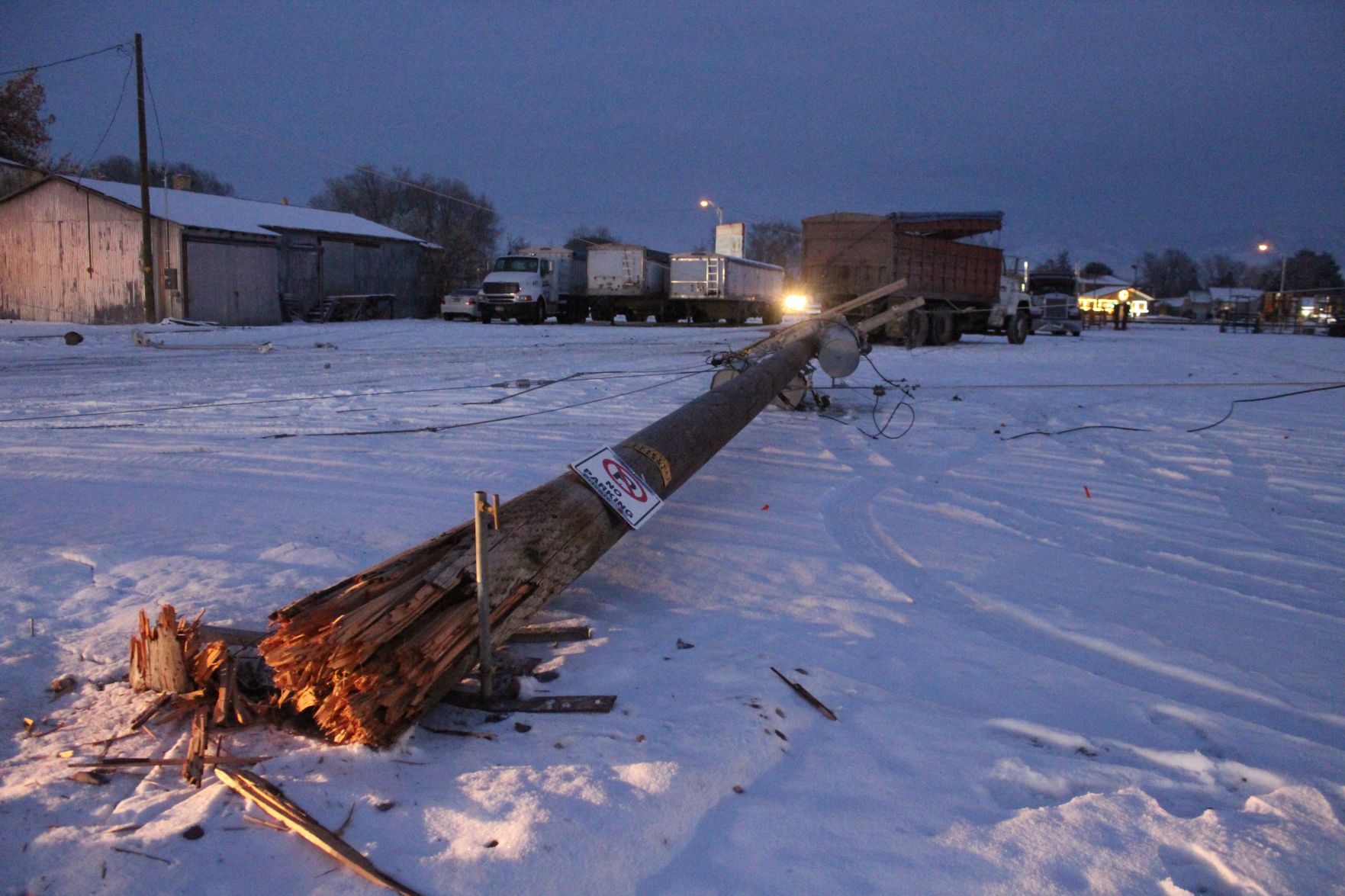 Truck clips line on utility pole, causes short power outage